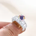 Luxe zilveren ringenset met een ronde regenboog moissaniet en fonkelende zijstenen - AB Wit