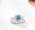 925 sterling silver ring set with round blue moissanite stone and side diamonds - Sapphire Blue