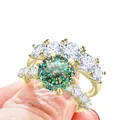 Luxe 7.8ct moissanite ring set in S925 sterling zilver met een goudkleurige afwerking - Maat 5 / Blauwgroen 100-facet geslepen