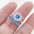 Macro shot of S925 silver moissanite ring set with sea blue gemstone and side stones - Sapphire Blue