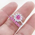 Close-up of S925 sterling silver halo ring set with sparkling pink moissanite stones - US 5 / Pink