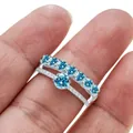 V-shaped 925 silver ring set with large blue moissanite stones and stacked pavé diamonds - Size 5 / Aqua