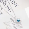 Halskette aus S925 Silber mit blauem Moissanit im Mondsichel-Design und Pavé-Besatz - Aqua