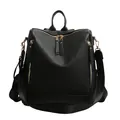 Women's black pebbled leather backpack with gold zippers for casual travel use - Black with Pendant