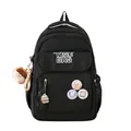 Zaino scolastico nero minimalista con badge a fumetti e ciondoli di peluche morbidi - Nero