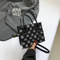Chic black and white checkerboard tweed crossbody bag with fringe trim and gold hardware - Tweed Style / Black Lattice