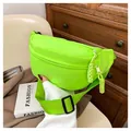 Detail of neon green nylon waist bag featuring matching rope zipper pulls and buckle strap - Fluorescent Green
