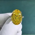 Macro detail of 30ct oval yellow high-carbon diamond ring with pave setting - Size 5 / Yellow
