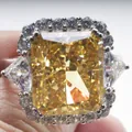 Radiant cut yellow carbon diamond ring with side trillion stones and halo setting - Size 5 / Yellow