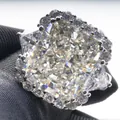 Luxurious radiant cut pink diamond ring with halo setting and triangular side stones - Size 5 / White
