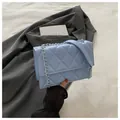 Detail of light blue quilted PU leather bag with silver chain strap and shoulder pad - Blue