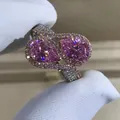 S925 silver ring featuring two pear-cut pink gems with sparkling halo set on a paved band - Size 5 / Pink