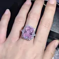 Radiant cut pink carbon diamond ring with side trillion stones in silver setting - Size 5 / Pink