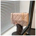 Champagne pink quilted crossbody bag with silver chain strap and metal ring buckle - Pearlescent Pink