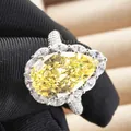 6ct Pear cut yellow carbon diamond ring with marquise halo on a silver band - Size 5 / Silver