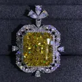 Close-up of a 15-carat radiant cut yellow diamond pendant set in polished silver metal - Yellow