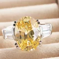 Luxury sterling silver ring with 6-carat oval yellow stone and trapezoid side diamonds - Size 5 / Yellow