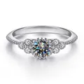 Classic S925 sterling silver ring featuring a round moissanite center stone and side accents - Size 5 / Gray