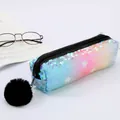 Detail of mermaid sequin pencil case featuring star patterns and black fur ball pendant - Rainbow with Star