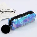 Detailed macro view of mermaid sequins pencil case with a soft pompom charm and star motifs - Blue With Star