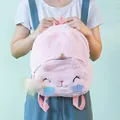 Detail view of pink plush unicorn backpack with cat embroidery and shell accents - Pink with Shell