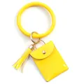 Detail of bright yellow bangle keychain with mini patent leather purse and tassel charm - Yellow
