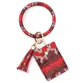 Detail of red and black snakeskin pattern card holder with tassel and gold hardware - Red
