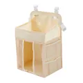 Detail view of beige hanging diaper organizer with breathable mesh pockets and hooks - Beige