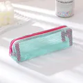 Detail of mint green mesh pencil case with hot pink zipper and translucent texture - Small / Light Blue