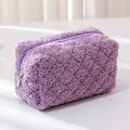 Detailed close-up of soft purple teddy fleece texture and matching zipper on pouch - Purple