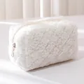 Close-up detail of soft white plush pencil case showing smooth zipper and fluffy texture - White