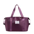 Purple large capacity travel bag made of waterproof nylon with durable fabric handles - Deep purple