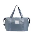 Large capacity gray-blue travel tote bag featuring nylon fabric and drawstring side pockets - Blue
