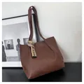 Detail view of deep brown large tote bag with textured faux leather and fashion ribbon accessory - Dark Brown