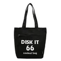 Black canvas tote bag featuring white Disk It 66 print and outer zipper pocket - Black
