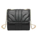 Chic black quilted crossbody bag with stylish gold chain strap and elegant flap design - Black