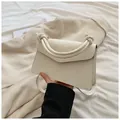 Elegant ivory white structured small square bag with knotted handle and adjustable strap - White