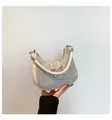 White rhinestone hobo bag with a silver bow ornament and leather handle strap - White