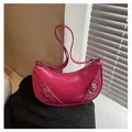 Stylish magenta crescent saddle bag in glossy leather finish with silver metal buckle - Rose Red