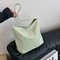 Light green nylon handbag with white embroidery and soft round handles for women - Standard / Green