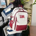 Student backpack with SJM letter print in white and red contrast colors for school use - Red