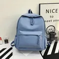 Minimalist light blue large capacity backpack with textured nylon and woven rope zippers - Blue