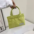 Mini light green corduroy handbag with vertical texture and purple woven label - Green
