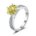 Macro shot of S925 silver ring featuring a large round yellow moissanite and side diamonds - Size 5 / Lemon Yellow (3 Carat)