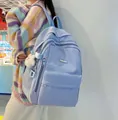 Light blue multi-pocket nylon backpack with a white teddy bear charm for students - Blue