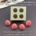 Macro shot of 4-hole strawberry silicone mold showing exact 5x4.7x2.4cm dimensions - Four Small Strawberries / Gray