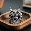 Macro shot of retro silver gothic skull ring with horns and detailed relief texture - J258 Orc