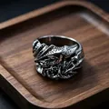Macro shot of silver retro dragon ring showing detailed scales and vintage metal engraving - J259 Claw