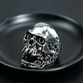 Macro shot of a skull-shaped metal ring with realistic details and dark punk aesthetic - J263 Skull
