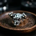 Detailed close-up of a vintage bull head silver ring with rustic antique metal finish - J275 Bull Head